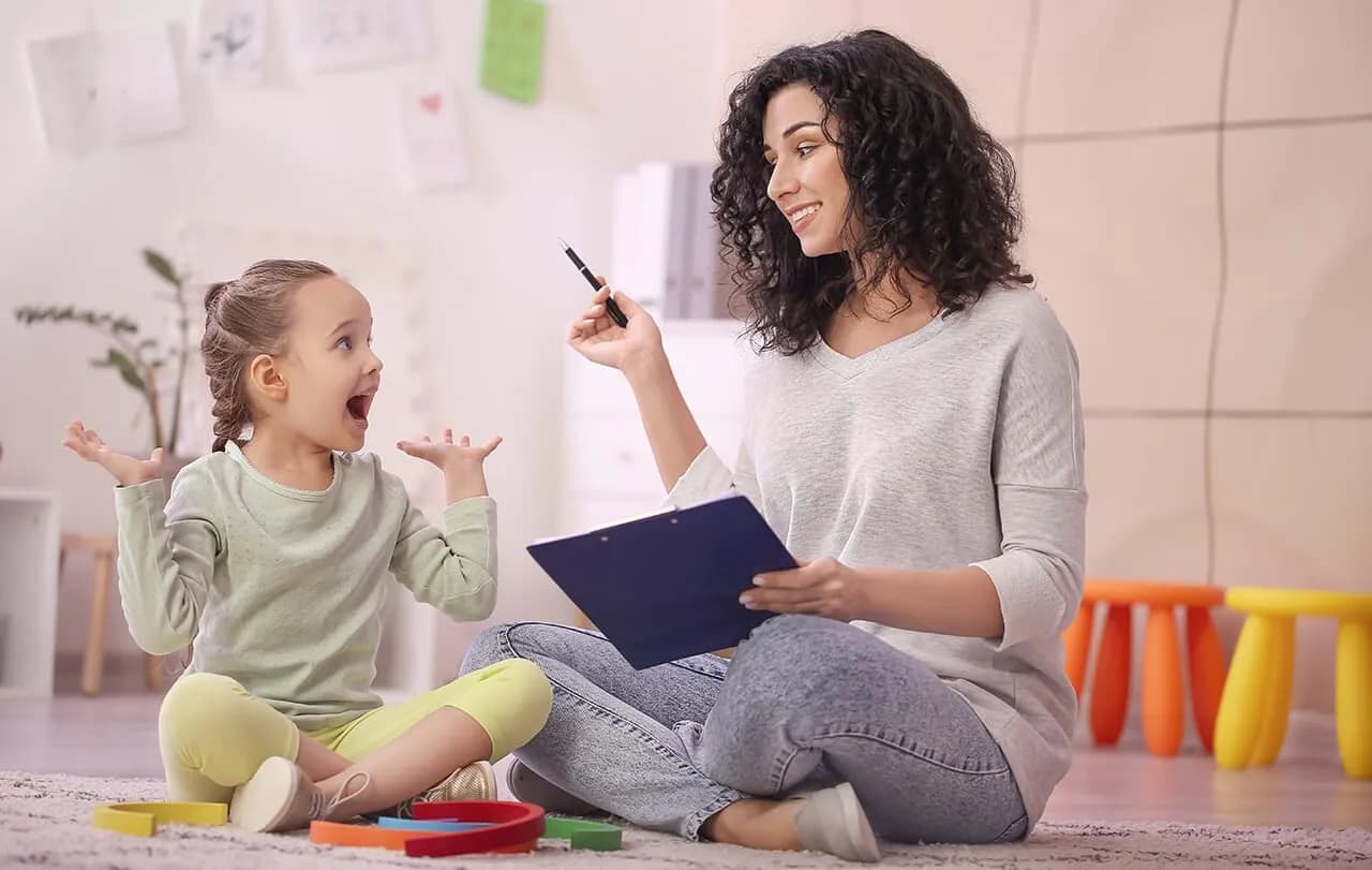 Diverse group of ABA therapy staff members smiling and welcoming
